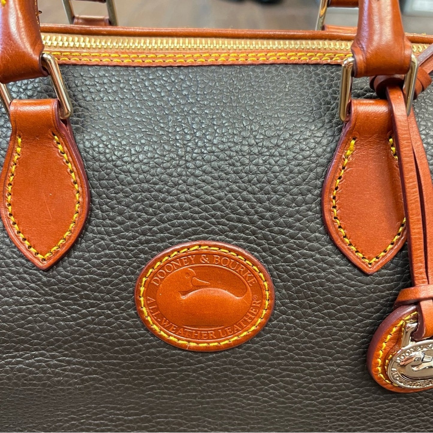 Dooney & Bourke all weather leather barrel satchel