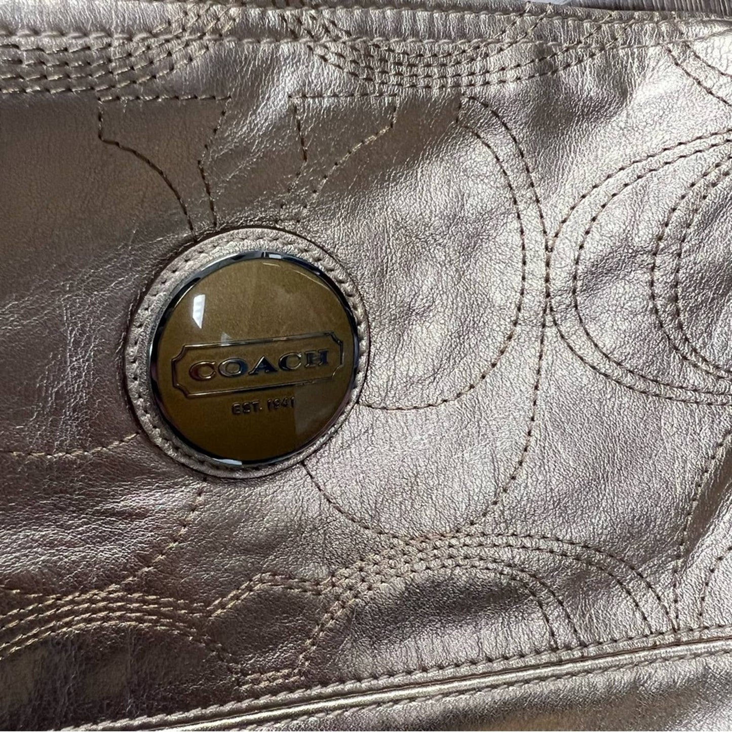 Coach signature stitch in metallic gold hobo