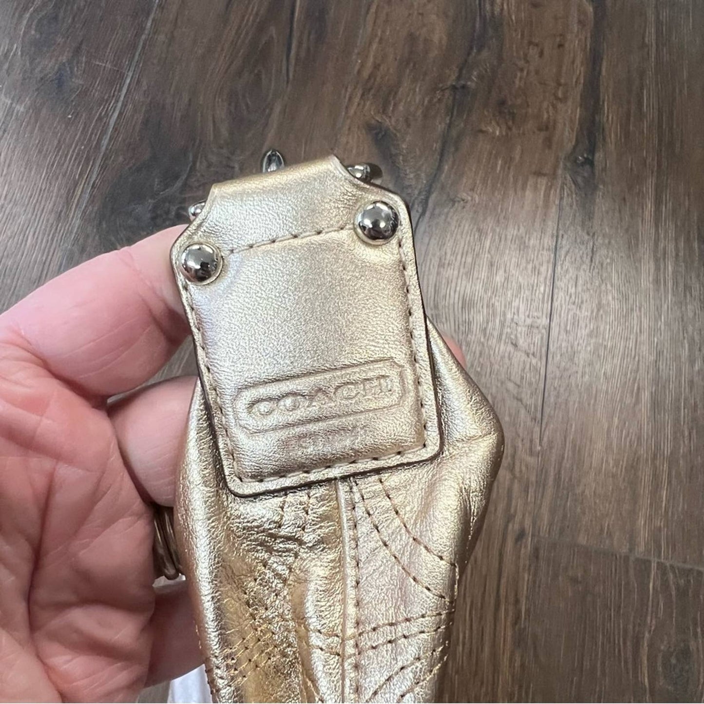 Coach signature stitch in metallic gold hobo