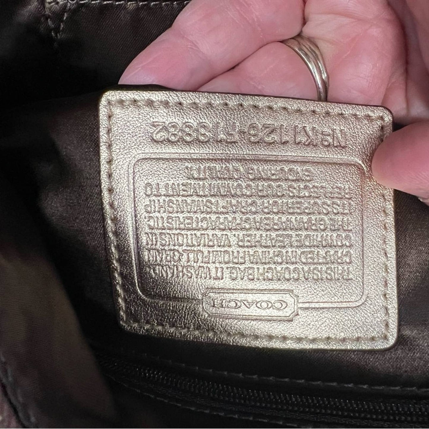 Coach signature stitch in metallic gold hobo