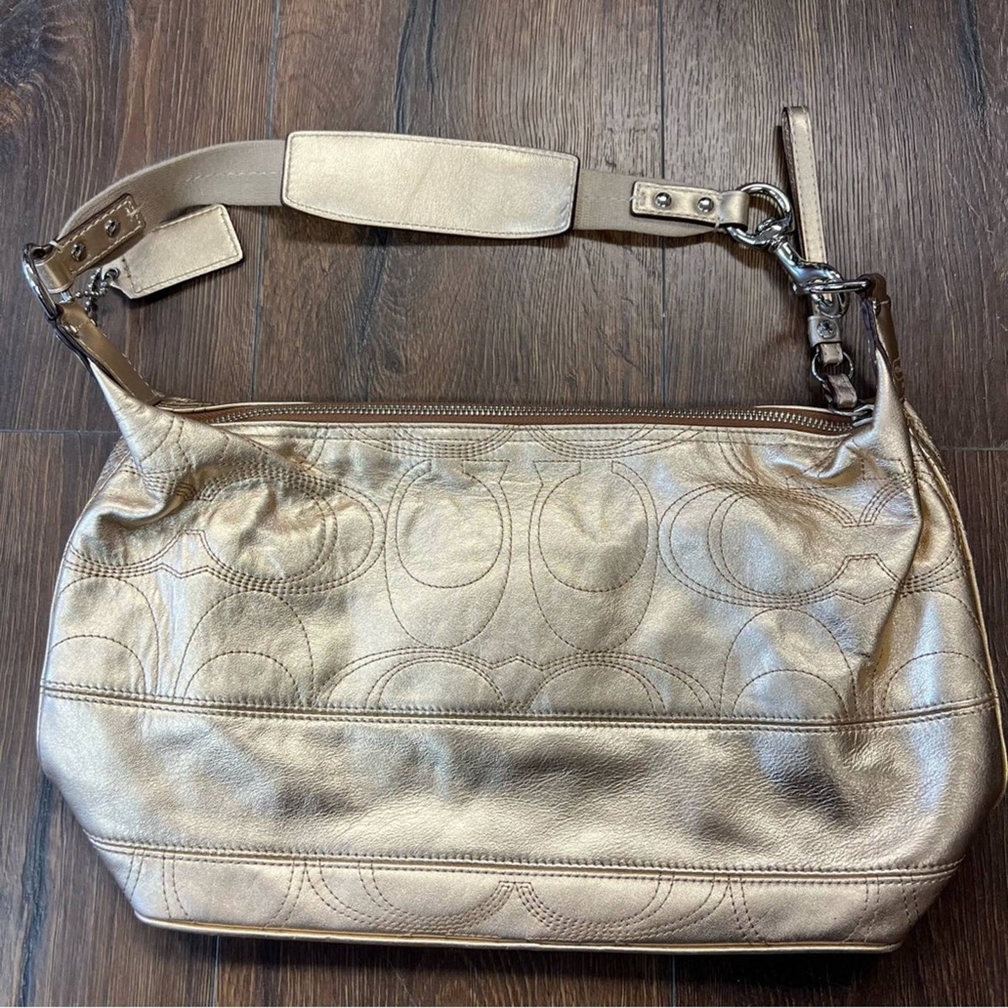 Coach signature stitch in metallic gold hobo