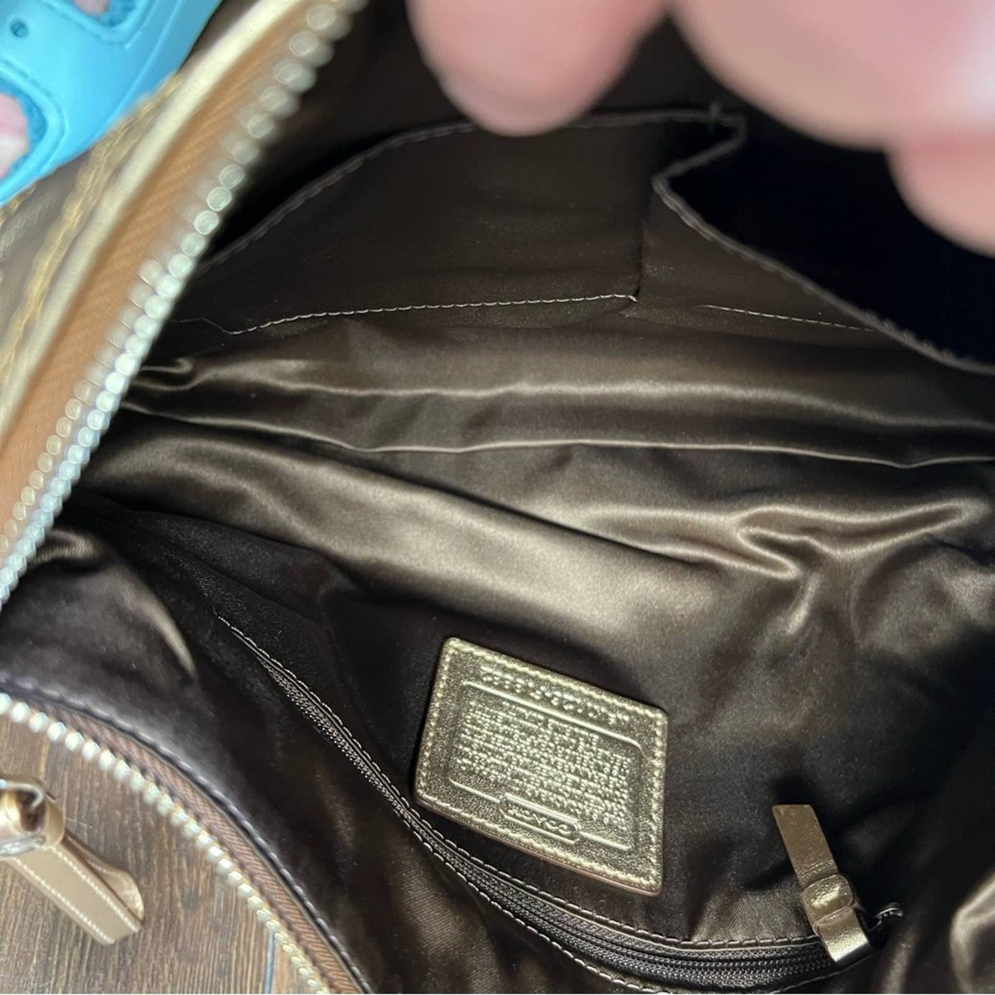 Coach signature stitch in metallic gold hobo